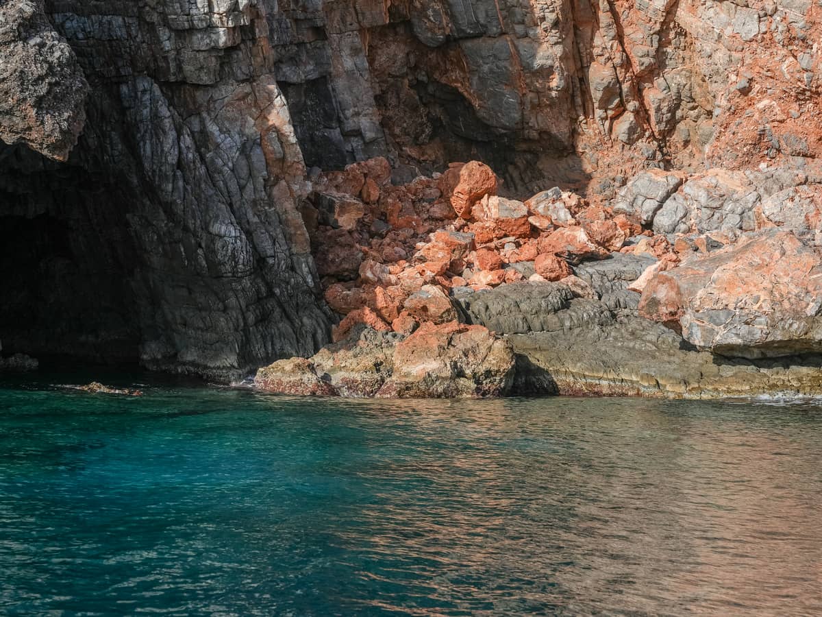A sheltered, clear-water cove seen from the boat
