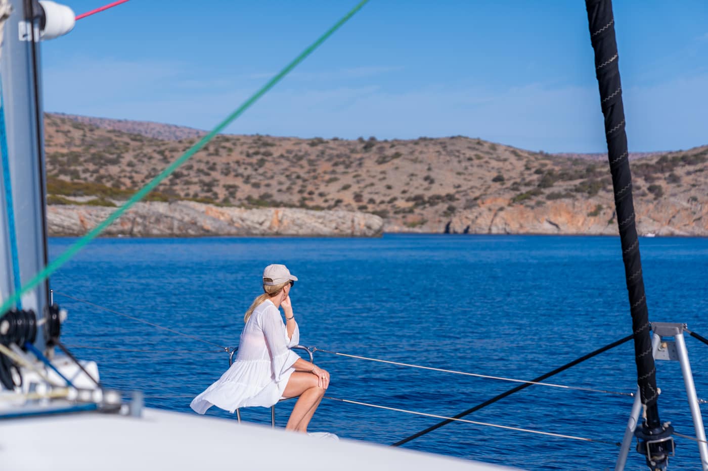 Sailing along the Cretan coast from the deck of a catamaran